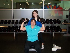 Carolyn spots Gina during a weightlifting session. “I can’t picture myself training with anyone else. We’re a great team.”