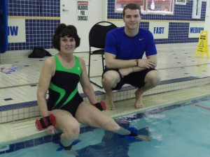 John helps member Donna Martin rehabilitate her knee replacement by working on hip rotation strength.