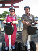 Blanche and her husband do Disney with segways.