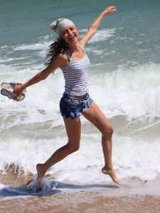 Happy young woman on beach, pic